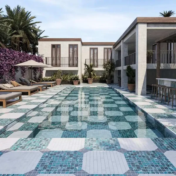  Swimming pool bottom decorated with different colors of pool tiles creating patterns 