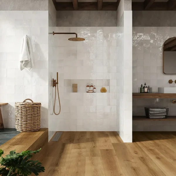 Handmade tile manufacturers catalogue´s picture showing a stylish shower in white 