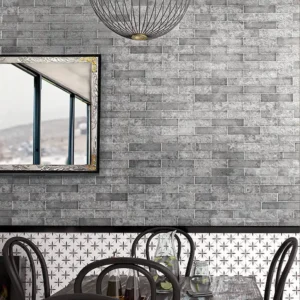 Picture of grey aged brick tiles covering the wall of a restaurant