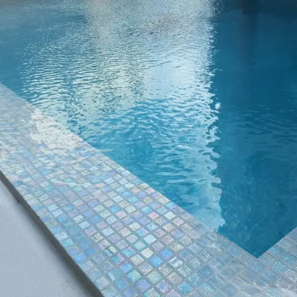 Pool tile manufacturers catalogue´s picture showing pearly tiles set on a pool  