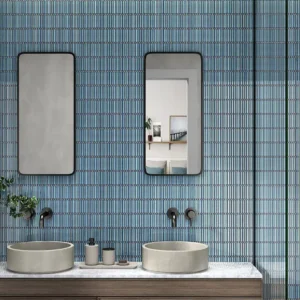 Mosaic tiles covering the wall of a modern restroom 