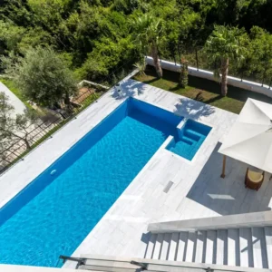 Picture of swimming pool beautifuly renewed with pool tile manufacturers products 