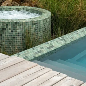 Swimming pool tiles in different tones of green mixed with natural textures