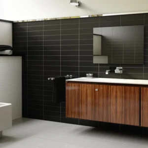 Urban style restroom decorated with black subway tiles 
