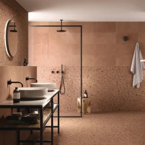Terrazzo effect tiles in warm colors decorating a restroom 