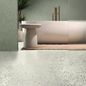 Light green terrazzo effect tiles placed on a modern style bathroom 